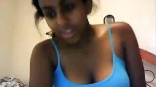 Hot black girl teases with her big tits and rubs her hairy pussy