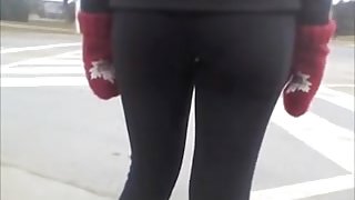 Candid street booty wrapped into tight pants on a cool day